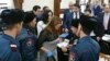 Armenia - Yerkir Tsirani party leader Zaruhi Postanjian argues with police officers moments after a violent incident at Yerevan's municipal council, 13 Februay 2018.