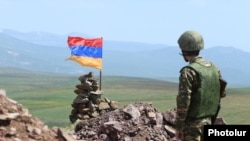 Armenia - An Armenian soldier stands guard on the border with Azerbaijan, June 17, 2021.