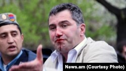 Armenia -- Armen Martirosian, deputy chairman of the opposition Zharangutyun party, is detained by riot police station during an opposition rally in central Yerevan, 9Apr2013.