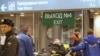 Russia -- A victim of a bomb explosion is wheeled out by medics at Moscow's Domodedovo airport, 24Jan2011