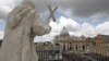 Vatican -- Faithful stand in front St Peter's basilica during the Easter Holy Mass, 08Apr2012