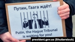 Плякат на мітынгу ў Амстэрдаме. Ілюстрацыйнае фота