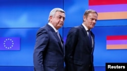 Belgium - Armenia's President Serzh Sargsyan (L) walks next to European Council President Donald Tusk after a joint news statement in Brussels, Belgium February 27, 2017