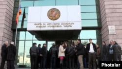 Armenia - People wait outside a district court building in Yerevan, January 9, 2012.