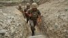 Nagorno-Karabakh -- Armenian soldiers of the self-proclaimed republic of Nagorno-Karabagh walk in a trench at the frontline on the border with Azerbaijan near the town of Martakert, 06Jul2012