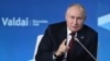Russia - Russian President Vladimir Putin gestures while speaking at the annual meeting of the Valdai Discussion Club in Sochi, October 5, 2023.