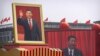 CHINA -- Participants cheer beneath a large portrait of Chinese President Xi Jinping during a parade to commemorate the 70th anniversary of the founding of Communist China in Beijing, October 1, 2019