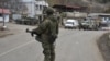 A Russian peacekeeper stands guard on a road in the town of Lachin (file photo).