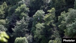 Armenia - A tourist rides a zipline in Tavush province, July 21, 2018.