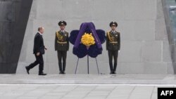 Armenia -- Russian President Vladimir Putin attends a commemoration ceremony for the 100th anniversary of the Armenian genocide at the Tsitsernakaberd Memorial in Yerevan, April 24, 2015