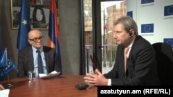 Armenia -- Johannes Hahn (R), the Commissioner for European Neighborhood Policy & Enlargement Negotiations talks to RFE/RL Armenian Service director, 18 Mar, 2015