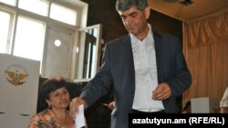 Nagorno Karabakh - Vitali Balasanian, the main opposition candidate, casts his vote in a presidential election, Askeran,19Jul2012 