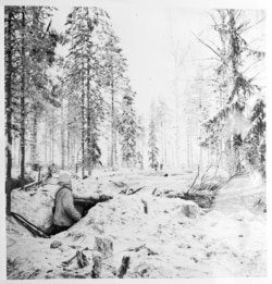 A Finnish fighter scans the forest.