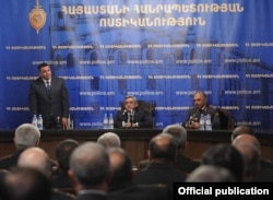 Armenia - President Serzh Sarkisian (C) introduces the newly appointed national police chief, Vladimir Gasparian (L), to senior police officials, 1Nov2011.