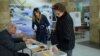Armenia - A woman votes in a polling station in Yerevan, 6Dec2015.