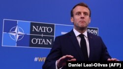 U.K. -- French President Emmanuel Macron speaks to the press on arrival at the NATO summit at the Grove hotel in Watford, northeast of London, December 4, 2019
