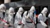 SOUTH KOREA - South Korean soldiers wearing protective gear sanitize a street in front of the city hall after the rapid rise in confirmed cases of the novel coronavirus disease of (COVID-19) in Daegu, southeast of the capital Seoul, South Korea, March 2, 