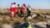 IRAN -- EDITORS NOTE: Graphic content / Rescue teams recover a body after a Ukrainian plane carrying 176 passengers crashed near Imam Khomeini airport in the Iranian capital Tehran early in the morning on January 8, 2020, killing everyone on board.