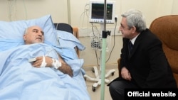 Armenia - President Serzh Sarkisian (R) visits wounded opposition presidential candidate Paruyr Hayrikian at a Yerevan hospital, 01Feb2013.