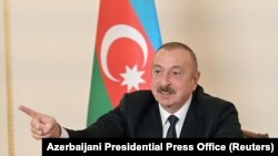 AZERBAIJAN -- Azerbaijani President Ilham Aliyev gestures as he speaks during an address to the nation in Baku, October 26, 2020