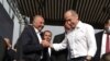 Armenia - Former President Robert Kocharian (R) greets Armen Charchian, director of the Izmirlian Medical Center, during a rally in Yerevan, May 9, 2021.