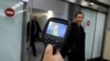 Kazakhstan - Kazakh sanitary-epidemiological service worker uses a thermal scanner to detect travellers from China who may have symptoms possibly connected with the previously unknown coronavirus, at Almaty International Airport, Kazakhstan January 21, 20